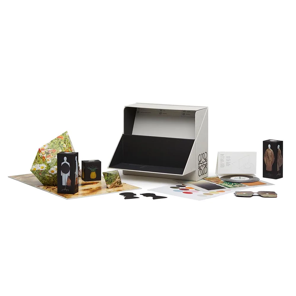 Loewe Show in a Box — complete box contents with silhouettes, vinyl, photographs and design objects